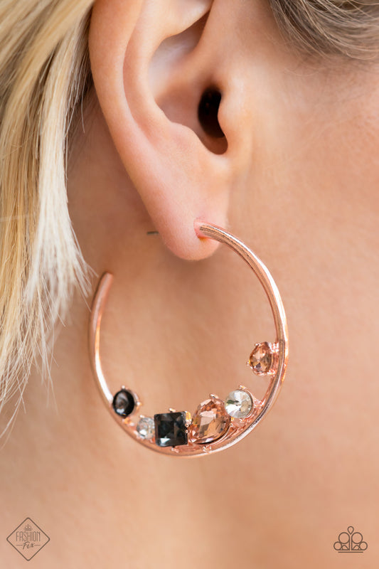 Attractive Allure Rose Gold Hoop Earring - Paparazzi Accessories  Featuring vivacious peach, white, and smoky rhinestones, a mashup of mismatched gems gather along the bottom edge of a smooth rose gold hoop, creating an extravagant lure. Earring attaches to a standard post fitting. Hoop measures approximately 1 3/4" in diameter.  Sold as one pair of hoop earrings.