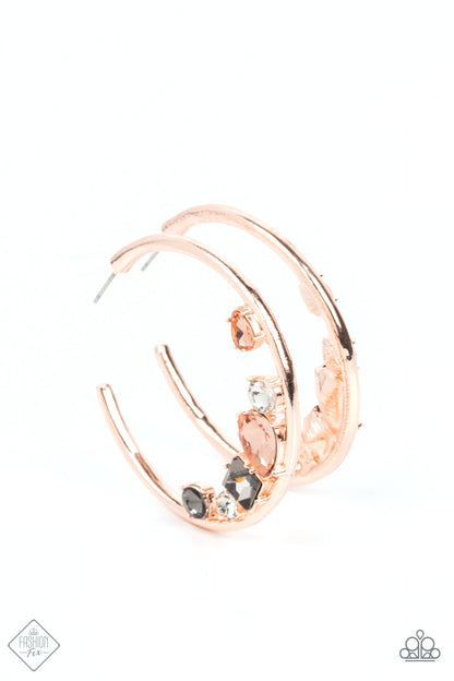 Attractive Allure Rose Gold Hoop Earring - Paparazzi Accessories  Featuring vivacious peach, white, and smoky rhinestones, a mashup of mismatched gems gather along the bottom edge of a smooth rose gold hoop, creating an extravagant lure. Earring attaches to a standard post fitting. Hoop measures approximately 1 3/4" in diameter.  Sold as one pair of hoop earrings.