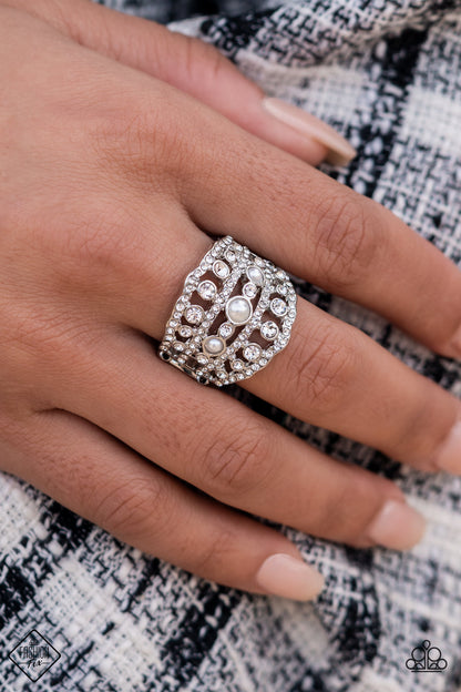 Sailboat Bling White Ring - Paparazzi Accessories  Layers of dainty silver bands, encrusted with sparkling white rhinestones, are accented with a trio of petite pearls on the centermost band. The stacked layers sweep across the finger, making an exquisite centerpiece. Features a stretchy band for a flexible fit.  Sold as one individual ring.
