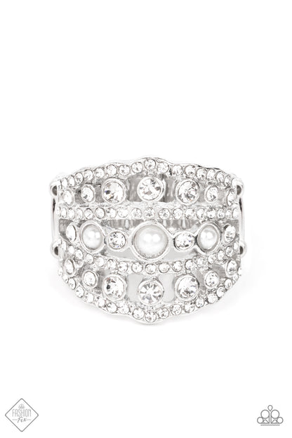 Sailboat Bling White Ring - Paparazzi Accessories  Layers of dainty silver bands, encrusted with sparkling white rhinestones, are accented with a trio of petite pearls on the centermost band. The stacked layers sweep across the finger, making an exquisite centerpiece. Features a stretchy band for a flexible fit.  Sold as one individual ring.