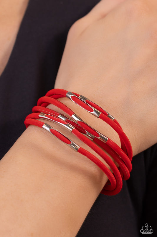 Magnetic Personality Red Magnetic Bracelet - Paparazzi Accessories  Cylindrical silver accents are threaded along strands of velvety red cords across the wrist, creating magnificent layers. Features a magnetic closure.  Sold as one individual bracelet.  Sku:  P9ED-RDXX-026XX
