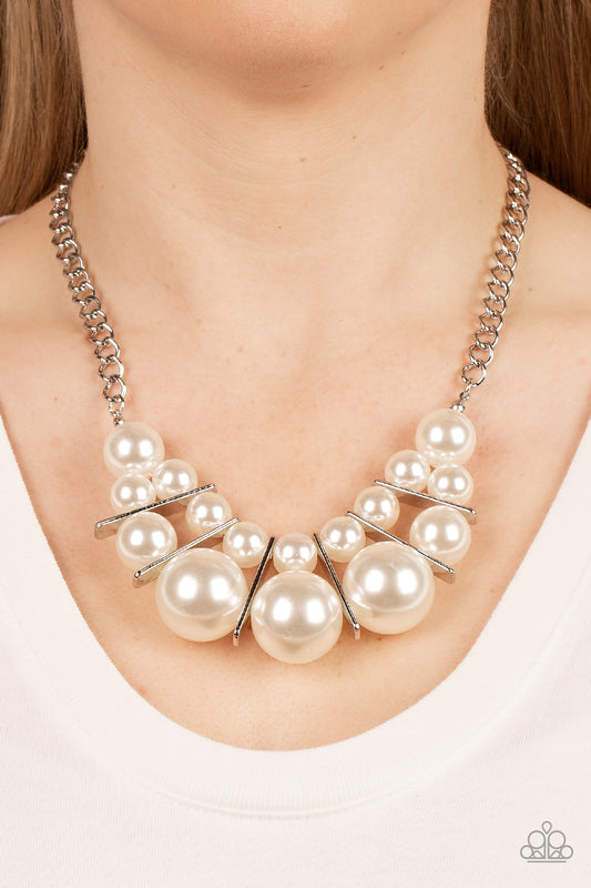 Challenge Accepted White Pearl Necklace - Paparazzi Accessories  Separated by rectangular silver frames, bubbly rows of classic and oversized white pearls are threaded along invisible wires at the bottom of a chunky silver chain for an effervescent explosion below the collar. Features an adjustable clasp closure.  Sold as one individual necklace. Includes one pair of matching earrings.