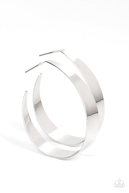 Flat Out Fashionable Silver Hoop Earring - Paparazzi Accessories  A flat silver ribbon loops into a voluminous hoop, catching and refracting the light with the curve. Earring attaches to a standard post fitting. Hoop measures approximately 1 3/4" in diameter.  Sold as one pair of hoop earrings.