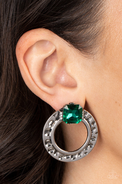 Smoldering Scintillation - Green Item #P5PO-GRXX-048XX Featuring a radiant cut, a green rhinestone sparkles between two dainty rows of glassy white rhinestones atop a hammered silver ring for a gritty yet glamorous finish. Earring attaches to a standard post fitting.  Sold as one pair of post earrings.
