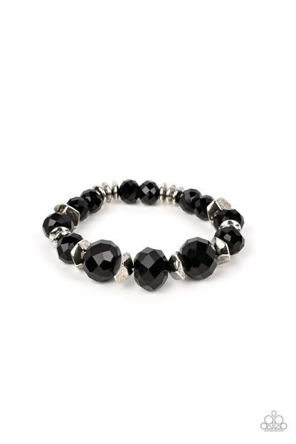 Astral Auras Black Bracelet - Paparazzi Accessories  Separated by silver discs and faceted silver accents, faceted black crystal-like gems are threaded along stretchy bands around the wrist for a stellar statement.  Sold as one individual bracelet.  Get The Complete Look! Necklace: "Cosmic Cadence - Black" (Sold Separately)