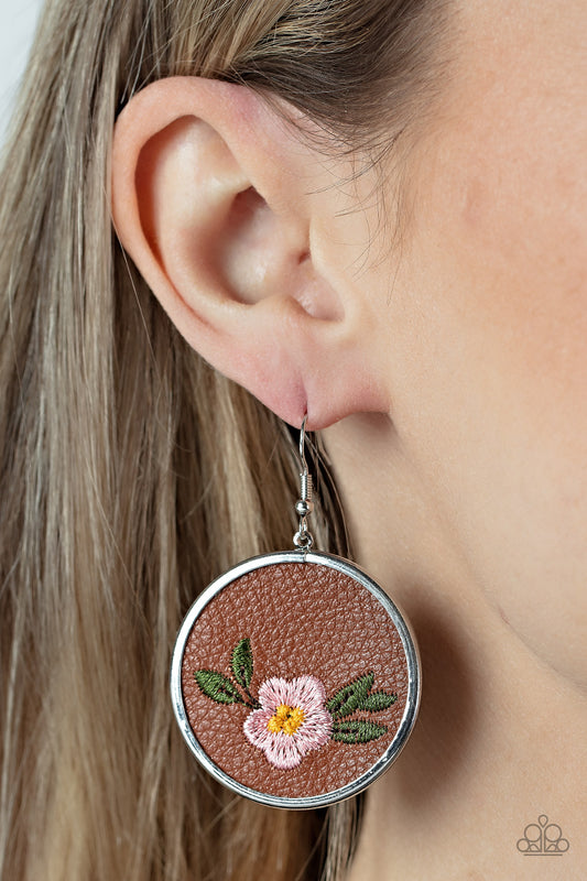 Prairie Patchwork Pink Earring - Paparazzi Accessories  A leafy Gossamer Pink flower is embroidered along the bottom of a piece of leather that is encased in a sleek silver frame, blooming into a homespun fashion. Earring attaches to a standard fishhook fitting.  Sold as one pair of earrings.