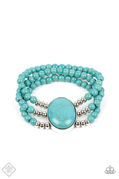 Stone Pools Blue Bracelet - Paparazzi Accessories  Layers of turquoise beads are threaded along stretchy bands that connect to a stunning oval turquoise stone, creating an extraordinary statement piece around the wrist.  Sold as one individual bracelet.