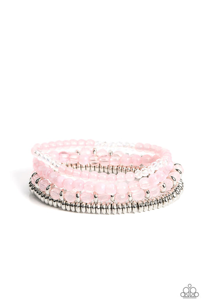 Destination Dreamscape Pink Bracelet - Paparazzi Accessories  A mismatched collection of opaque and crystal-like Gossamer Pink beads intermix with silver accents and white crystal-like beads along stretchy bands around the wrist, creating colorful layers.  Sold as one set of four bracelets.