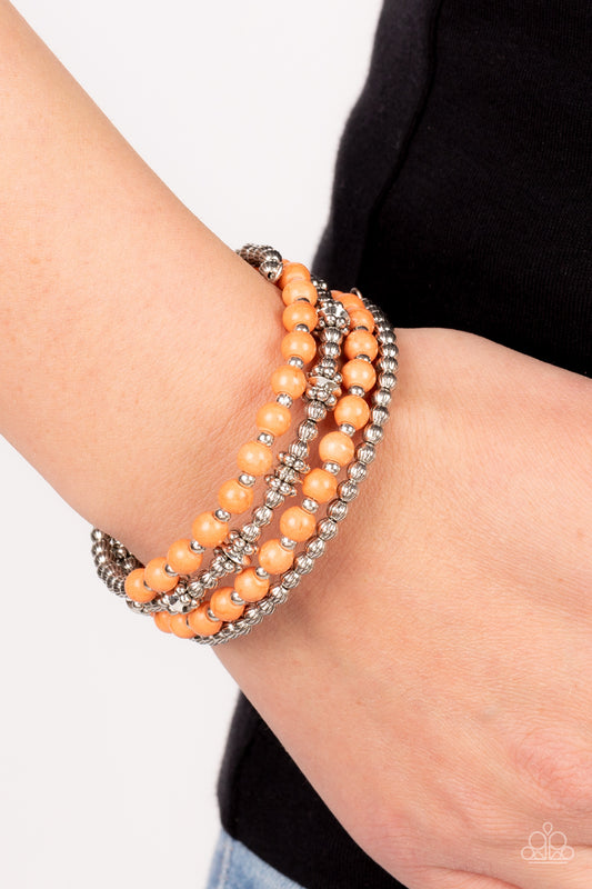 Road Trip Remix Orange Bracelet - Paparazzi Accessories  Infused with vibrant orange stone beads, a mismatched assortment of textured silver beads, studded silver rings, and dainty silver accents are threaded along a coiled wire, creating an earthy infinity wrap around the wrist.  Sold as one individual bracelet.