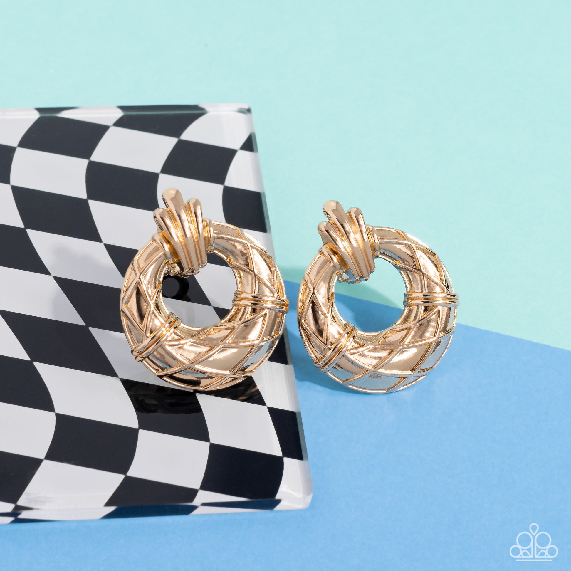 Metro Voyage Gold Clip-On Earring - Paparazzi Accessories  Faux gold wires wrap across the front of a curvy hoop at the bottom of a decorative gold fitting, resulting in an edgy refinement. Earring attaches to a standard clip-on fitting.  Sold as one pair of clip-on earrings.  P5CO-GDXX-078XX