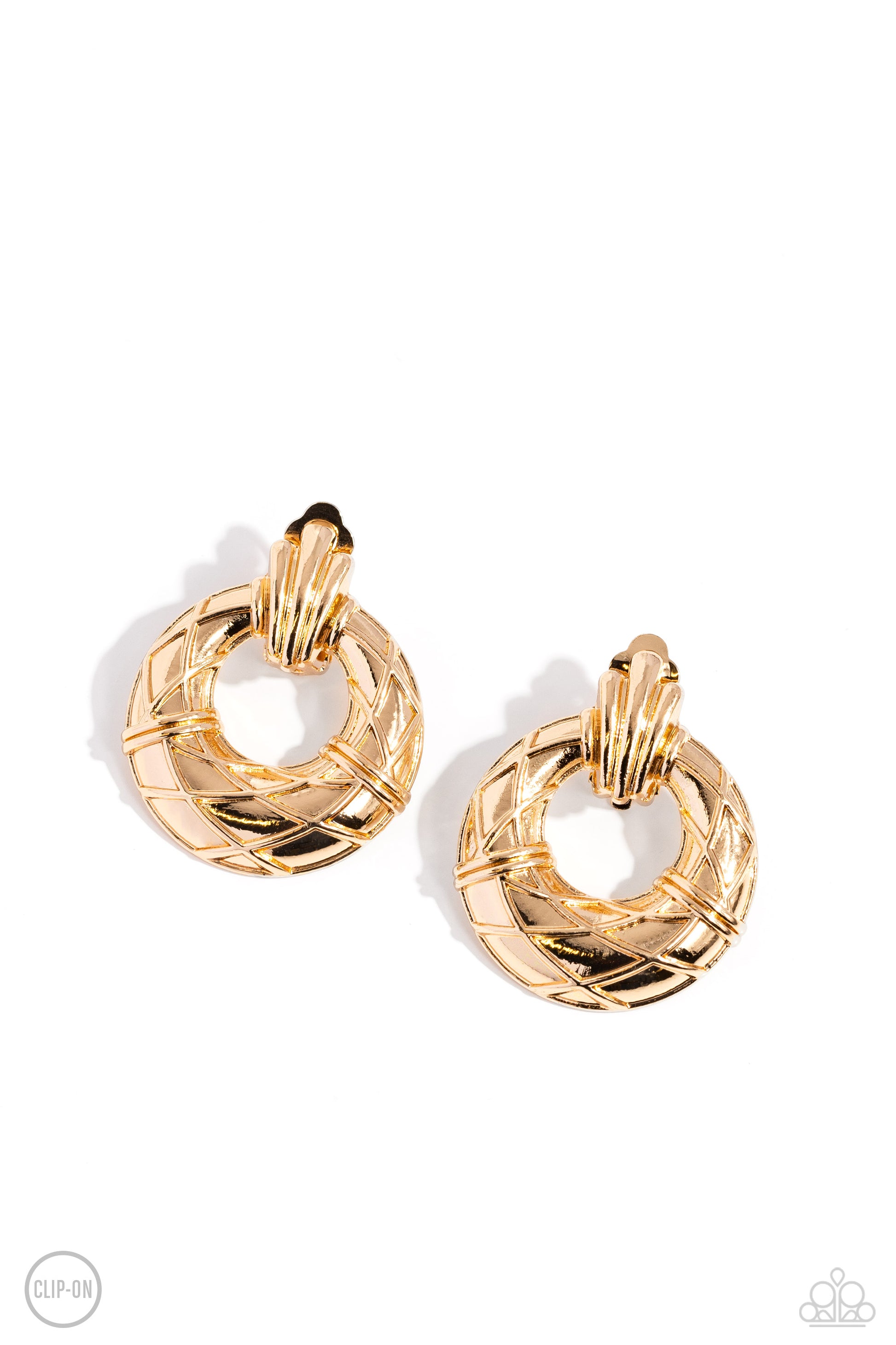 Metro Voyage Gold Clip-On Earring - Paparazzi Accessories  Faux gold wires wrap across the front of a curvy hoop at the bottom of a decorative gold fitting, resulting in an edgy refinement. Earring attaches to a standard clip-on fitting.  Sold as one pair of clip-on earrings.  P5CO-GDXX-078XX
