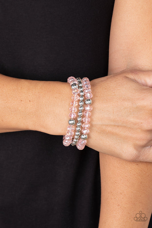 Prismatic Perceptions Pink Stretch Bracelet - Paparazzi Accessories  A playful collection of shiny silver beads and sparkly Gossamer Pink crystal-like beads are threaded along stretchy bands around the wrist, resulting in colorful layers.  Featured inside The Preview at GLOW! Sold as one set of three bracelets.
