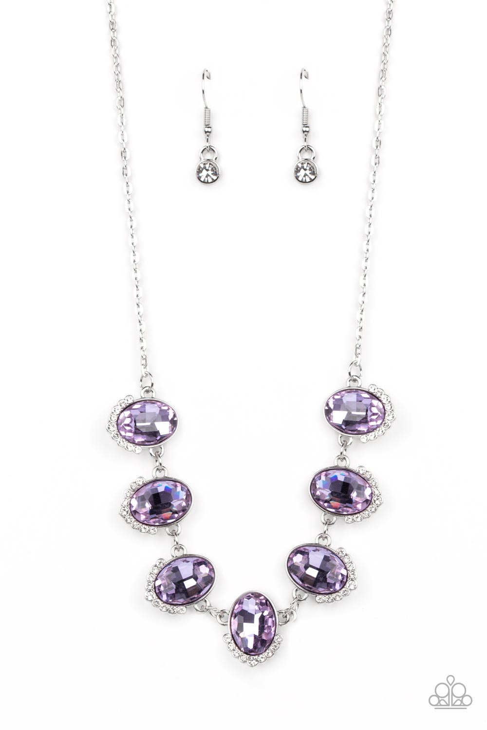 Unleash Your Sparkle Purple Necklace - Paparazzi Accessories  Dainty rows of glittery white rhinestones gently curve around the bottoms of oversized Very Peri oval gems. The sparkly frames delicately connect below the collar, creating a colorful centerpiece. Features an adjustable clasp closure.  Sold as one individual necklace. Includes one pair of matching earrings.