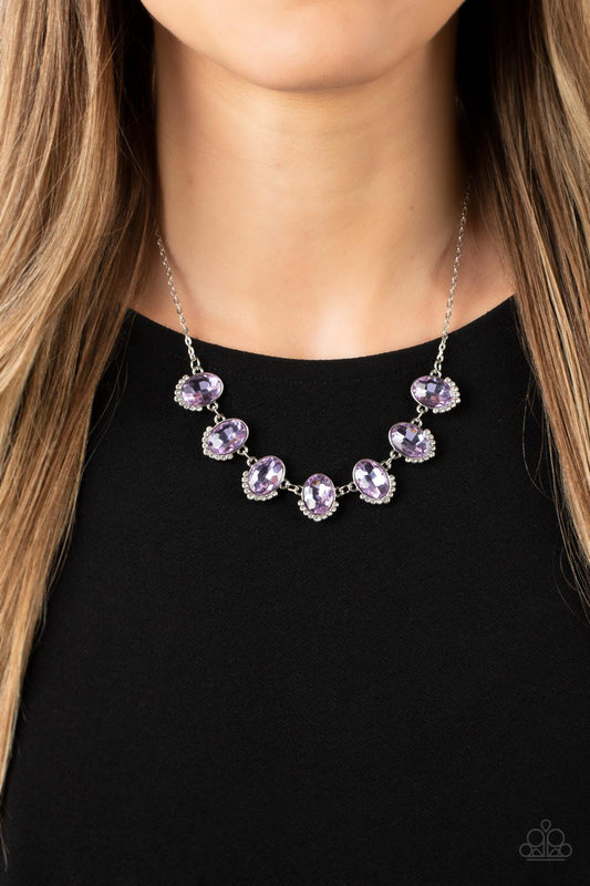 Unleash Your Sparkle Purple Necklace - Paparazzi Accessories  Dainty rows of glittery white rhinestones gently curve around the bottoms of oversized Very Peri oval gems. The sparkly frames delicately connect below the collar, creating a colorful centerpiece. Features an adjustable clasp closure.  Sold as one individual necklace. Includes one pair of matching earrings.