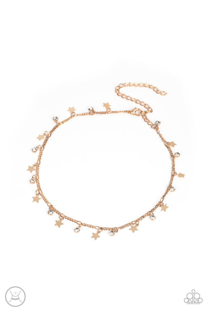 Little Lady Liberty Gold Choker Necklace - Paparazzi Accessories  Dainty white rhinestones and flat gold stars twinkle along a classic gold chain around the neck, resulting in a stellar fringe. Features an adjustable clasp closure.  Sold as one individual choker necklace. Includes one pair of matching earrings.