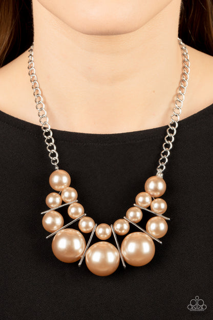 Challenge Accepted Brown Pearl Necklace - Paparazzi Accessories  Separated by rectangular silver frames, bubbly rows of classic and oversized brown pearls are threaded along invisible wires at the bottom of a chunky silver chain for an effervescent explosion below the collar. Features an adjustable clasp closure.  Sold as one individual necklace. Includes one pair of matching earrings.