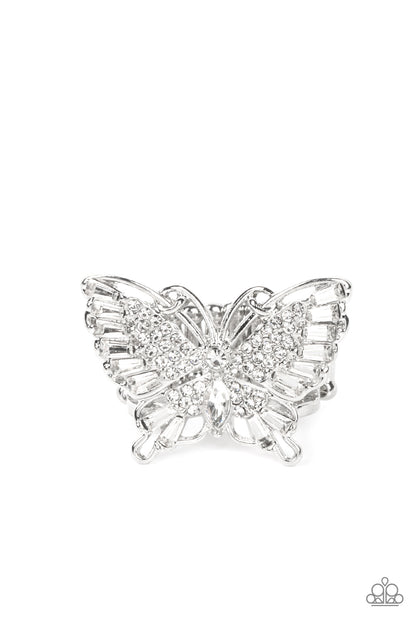 Fearless Flutter White Ring - Paparazzi Accessories  Sparkling with round, teardrop, and emerald cut white rhinestones, a silver butterfly fearlessly flutters atop the finger for a statement-making finish. Features a stretchy band for a flexible fit.  Sold as one individual ring.