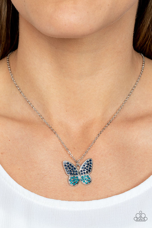 Flutter Forte Blue Butterfly Necklace - Paparazzi Accessories  Dotted in Skydiver and Harbor Blue rhinestones, a whimsical silver butterfly flutters along a dainty silver chain below the collar for an enchanting fashion. Features an adjustable clasp closure.  Sold as one individual necklace. Includes one pair of matching earrings.