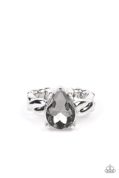 Law of Attraction Silver Ring - Paparazzi Accessories  A smoky teardrop gem sits regally atop a twisted silver band, creating a stunning centerpiece atop the finger. Features a dainty stretchy band for a flexible fit.  Sold as one individual ring.