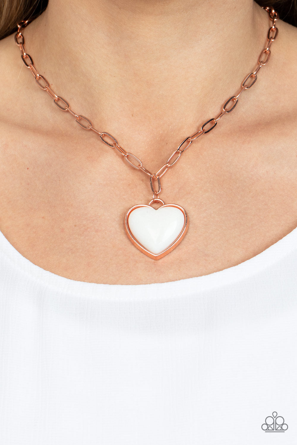 Everlasting Endearment Copper Necklace - Paparazzi Accessories  Chiseled into a charming heart, a quartz-like gemstone is pressed into the center of a shiny copper fitting at the bottom of a shiny copper chain for a sentimental statement. Features an adjustable clasp closure.  Sold as one individual necklace. Includes one pair of matching earrings.