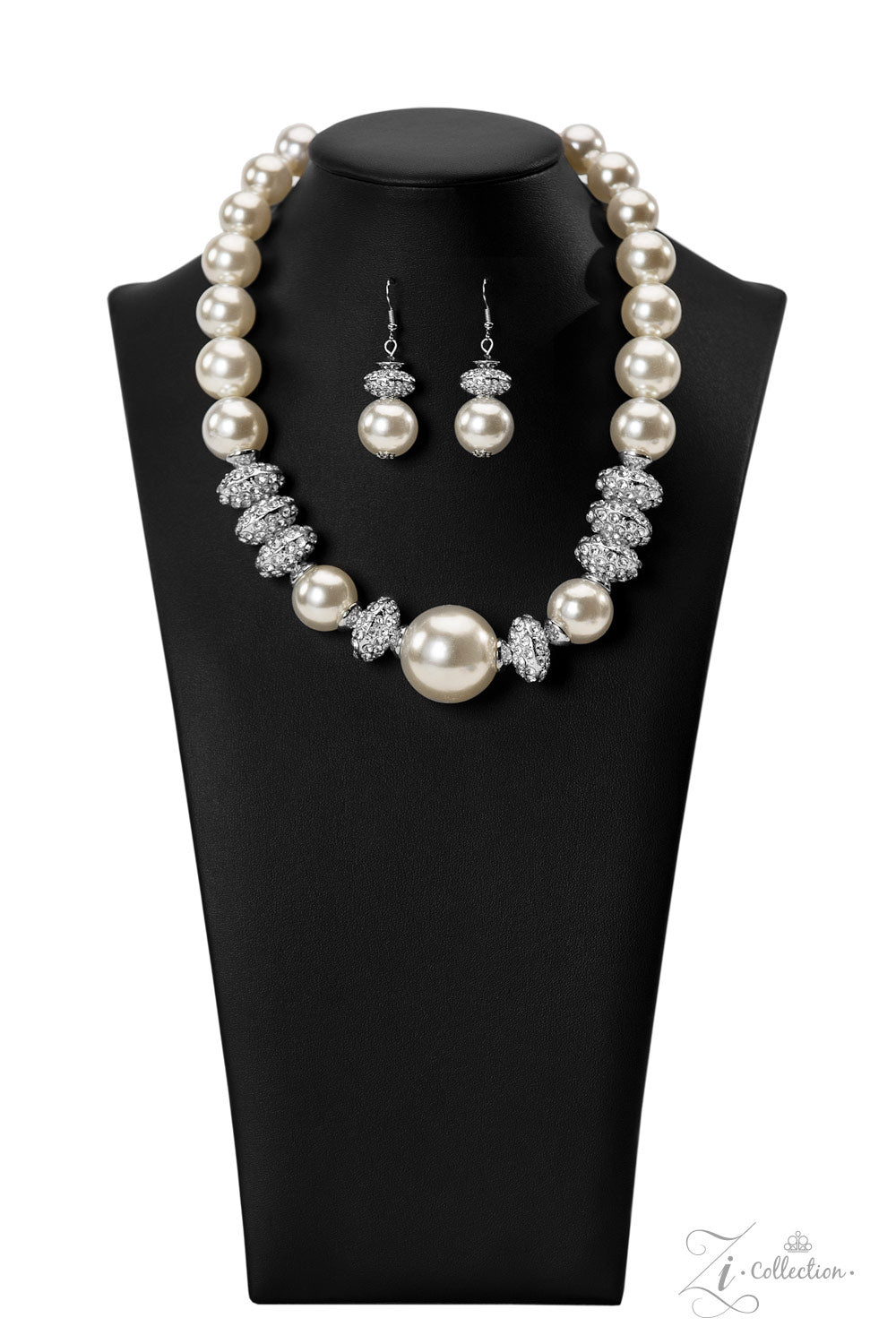 Noble 2022 Zi Collection Necklace - Paparazzi Accessories  Exaggerated white pearls gradually increase in size as they fall along the neckline, leading to a prominent centerpiece. The refined palette is complemented by shimmery silver accents, interspersed throughout the polished pearls and infused with sparkling rhinestones that scatter light in every direction. Features an adjustable clasp closure.