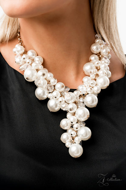 Imperfect glass-like beads and faceted clear beads are brushed in a hint of iridescence, allowing them to shimmer amongst an effervescent collection of classic and oversized white pearls. Dramatically clustered along a shiny gold chain, the bubbly display gives way to an extended tassel that emerges just below the collar, adding a timeless twist to its lustrous pearl palette. Features an adjustable clasp closure.