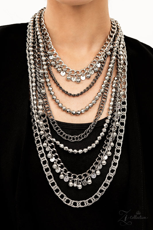 Featuring a range of oval and curb style links, a chaotic assortment of bulky silver and gunmetal chains fearlessly layers down the chest. Polished silver beads and textured silver discs swing from the thick curb chains, introducing audible shimmer to the intense industrial design. as two strands of high-sheen silver beads, chiseled into faceted metallic accents, drape between the mashup of tiered chains in a dramatic finish. Features an adjustable clasp closure.