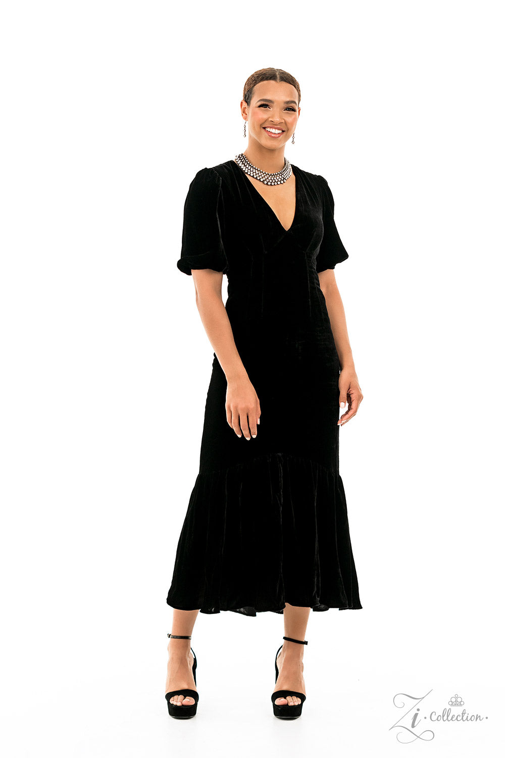 Thin bars of brass, etched in rugged linear texture and dotted with tiny brass studs, are topped by brilliant white rhinestones encased in pronged fittings. The bars are threaded along wires and separated by tiny brass beads, creating a dizzying display along the collar. The collision of glitz and grit fans out along the neckline, inviting onlookers to take a second look at the impeccable detail and dramatic sparkle. Features an adjustable clasp closure.