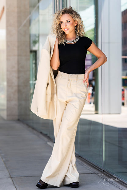 Thin bars of brass, etched in rugged linear texture and dotted with tiny brass studs, are topped by brilliant white rhinestones encased in pronged fittings. The bars are threaded along wires and separated by tiny brass beads, creating a dizzying display along the collar. The collision of glitz and grit fans out along the neckline, inviting onlookers to take a second look at the impeccable detail and dramatic sparkle. Features an adjustable clasp closure.