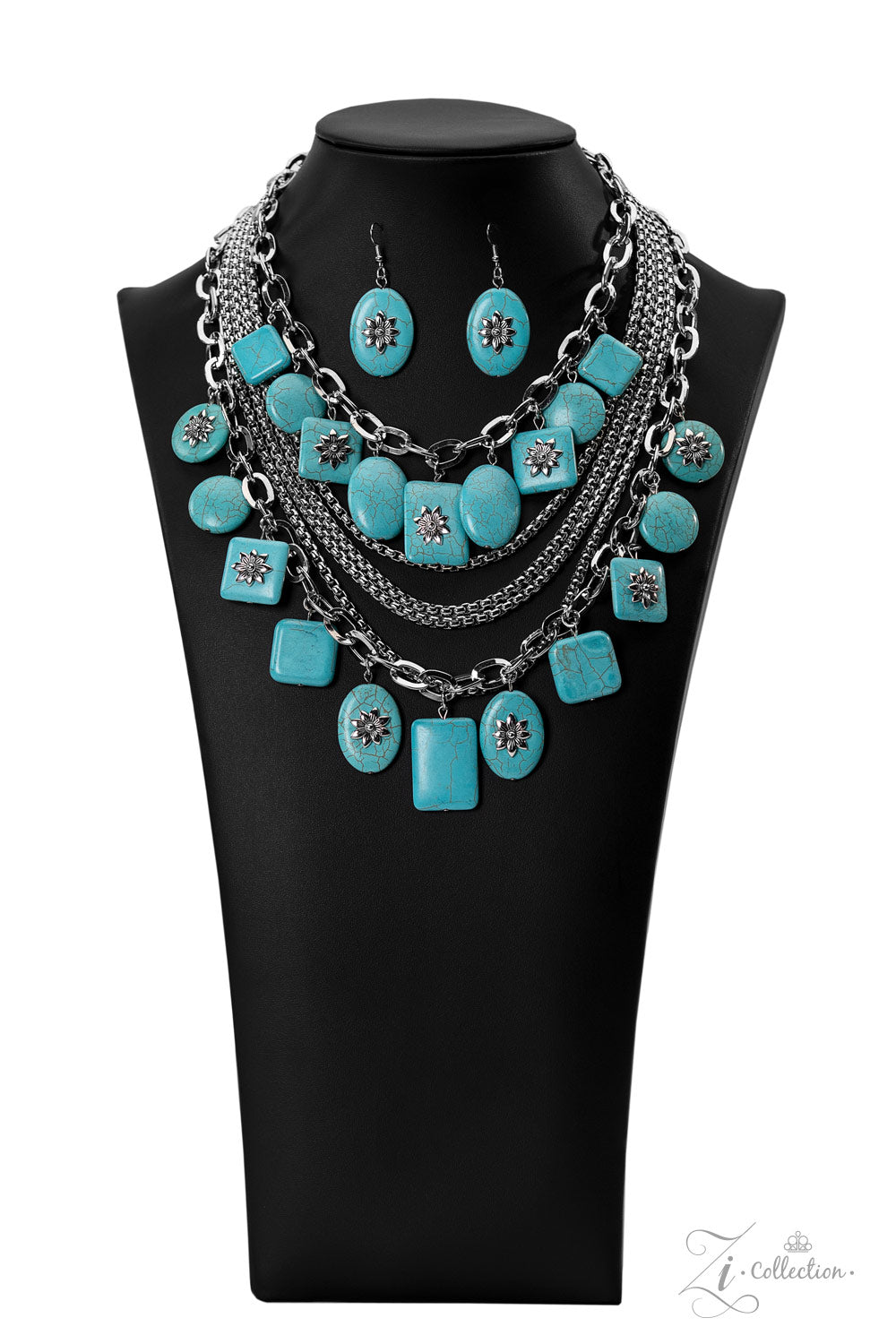 Strands of oversized silver chain links and rounded box chain in the same metallic sheen, drape into dramatic layers across the chest, creating a boisterous collision of texture. Smooth turquoise stones, chiseled into large, flat squares, circles, and rectangles, dance along the bulky silver chains, bringing vibrant splashes of color to the design. Finally, floral appliqués in an antiqued silver finish decorate the surfaces of some of the turquoise stones.