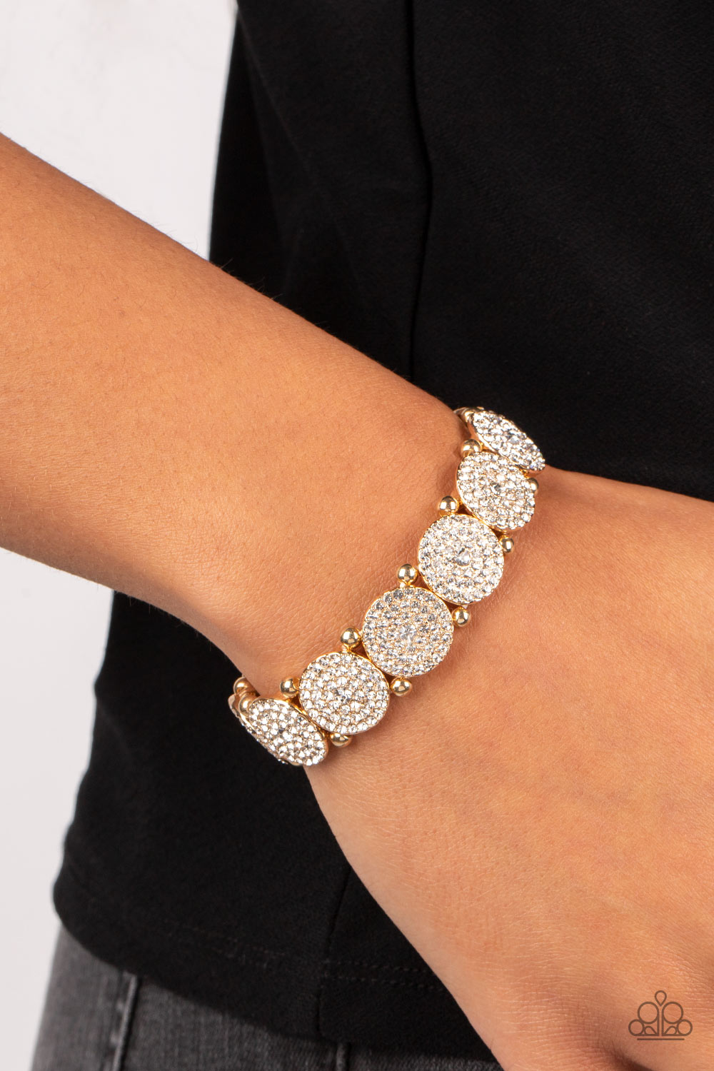 Palace Intrigue Gold Bracelet - Paparazzi Accessories  Separated by pairs of gold beads, icy white rhinestone encrusted gold frames glitter along stretchy bands around the wrist for a timeless twinkle.  Sold as one individual bracelet.
