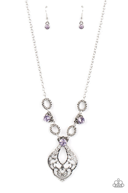 Contemporary Connections Purple Necklace - Paparazzi Accessories  Twisted silver links and oversized purple rhinestones delicately alternate below the collar. A hammered filigree filled silver pendant shimmers from the bottom of the centermost rhinestone, creating a contemporary pendant. Features an adjustable clasp closure.  Sold as one individual necklace. Includes one pair of matching earrings.