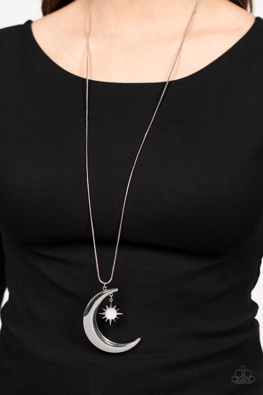 Astral Ascension White Necklace - Paparazzi Accessories  An opaque white bead is pressed into the center of a silver star that dances from the top of a silver half moon pendant, creating a celestial pendant at the bottom of a lengthened silver snake chain. Features an adjustable clasp closure.  Sold as one individual necklace. Includes one pair of matching earrings.
