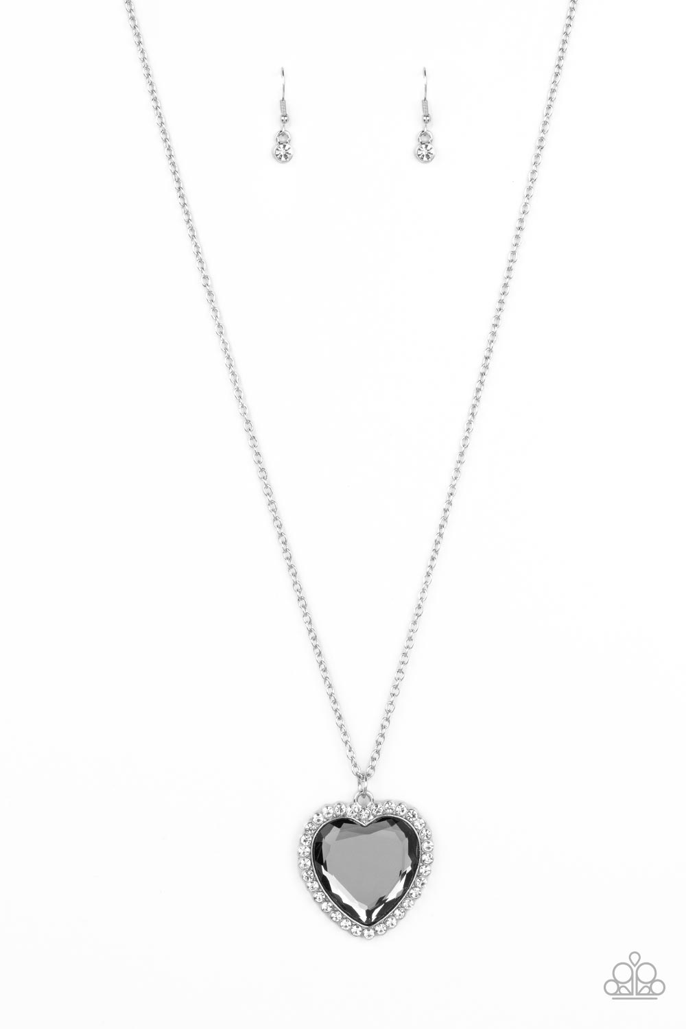 Prismatically Twitterpated Silver Necklace - Paparazzi Accessories  Bordered in glassy white rhinestones, an oversized smoky heart gem sparkles from the bottom of an extended silver chain for a flirty finish. Features an adjustable clasp closure.  Sold as one individual necklace. Includes one pair of matching earrings.