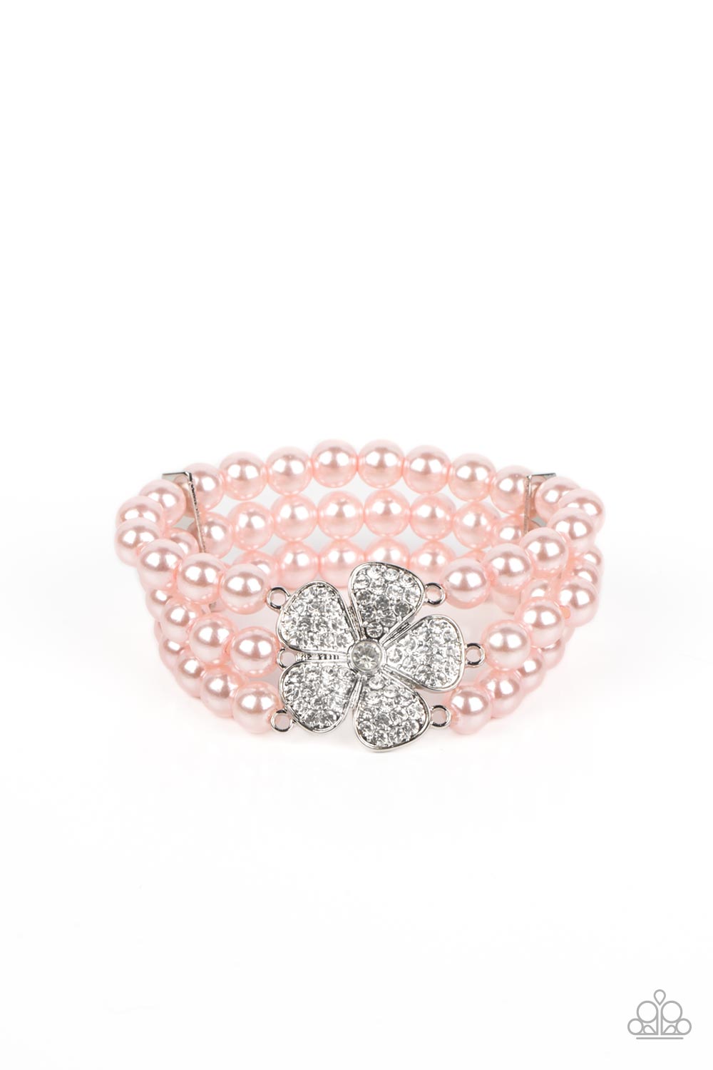 Park Avenue Orchard Pink Bracelet - Paparazzi Accessories  Separated by dainty silver plates, bubbly pink pearls are threaded along three stretchy bands around the wrist. Encrusted in glassy white rhinestones, a glitzy silver flower blooms at the center of the wrist for a fierce floral statement.  Sold as one individual bracelet.