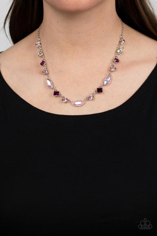 Irresistible HEIR-idescence Pink Necklace - Paparazzi Accessories  Varying in geometric shapes and shades of pink, glittery rose and fuchsia gems are sprinkled between iridescent rhinestone accents for a dreamy refined, and irresistible finish. Features an adjustable clasp closure. Due to its prismatic palette, color may vary.  Sold as one individual necklace. Includes one pair of matching earrings.