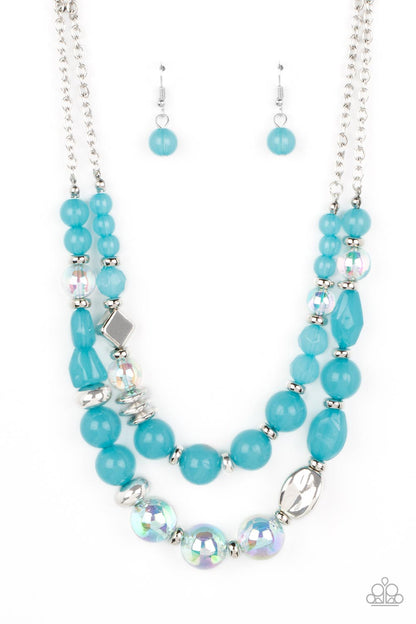Mere Magic Blue Necklace - Paparazzi Accessories  Featuring various shapes and finishes, a mismatched assortment of silver, iridescent, opaque Waterspout beads have been threaded along invisible wires below the collar, creating ethereal layers. Features an adjustable clasp closure. Due to its prismatic palette, color may vary.  Sold as one individual necklace. Includes one pair of matching earrings.