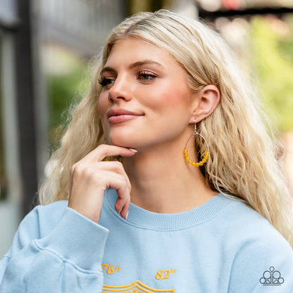 Catch a Breeze Yellow Earring - Paparazzi Accessories  Yellow stones are threaded along dangling silver hoops, evoking a trendy laidback design. Earring attaches to a standard fishhook fitting.  Featured inside The Preview at GLOW!  Sold as one pair of earrings.