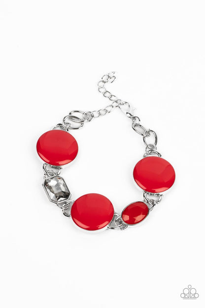 Dreamscape Dazzle Red Bracelet - Paparazzi Accessories  A rectangular sparkling smoky gem and a true red oval bead add elegance to a monochromatic collection of three oversized red circles. Set in silver frames, the whimsical collection attaches to a silver chain, for a refreshing splash of color around the wrist. Features an adjustable clasp closure.  Sold as one individual bracelet.
