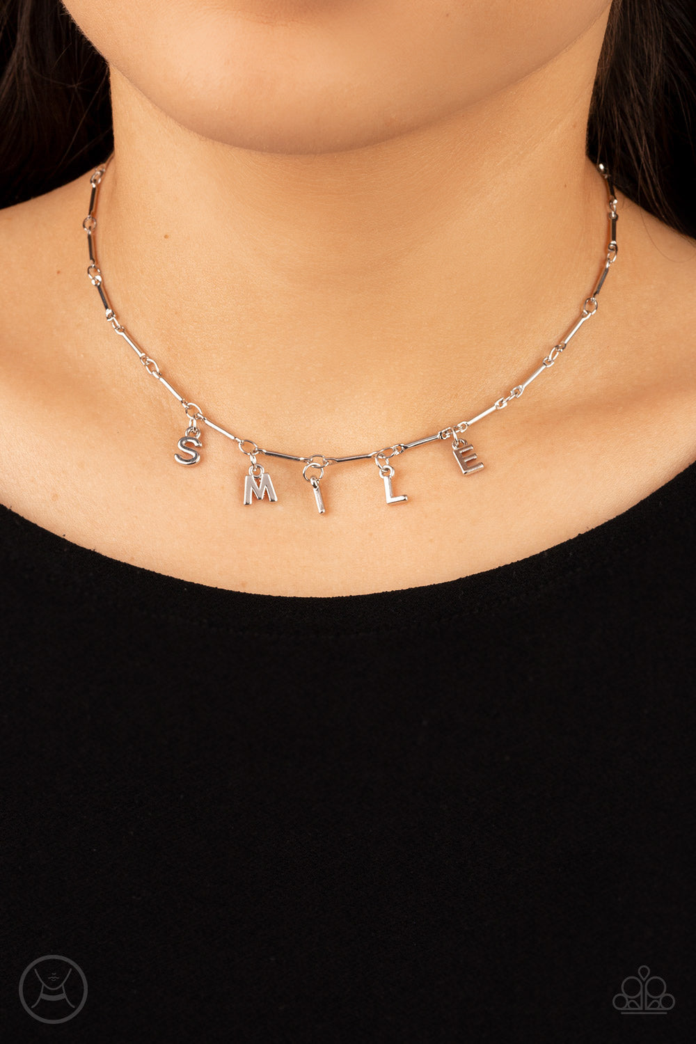 Say My Name Silver Choker Necklace - Paparazzi Accessories  Separated by dainty silver rods, silver letters spell out the word SMILE in a soft, and simple manner. Features an adjustable clasp closure.  Sold as one individual choker necklace. Includes one pair of matching earrings.