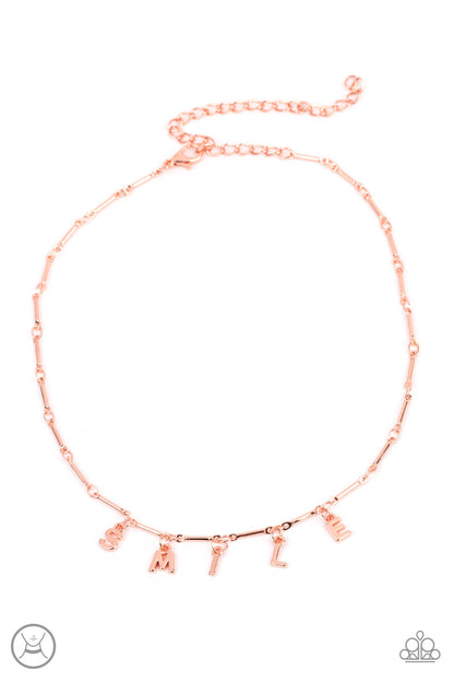 Say My Name Copper Choker Necklace - Paparazzi Accessories  Separated by dainty copper rods, copper letters spell out the word SMILE in a soft, and simple manner. Features an adjustable clasp closure.  Sold as one individual choker necklace. Includes one pair of matching earrings.