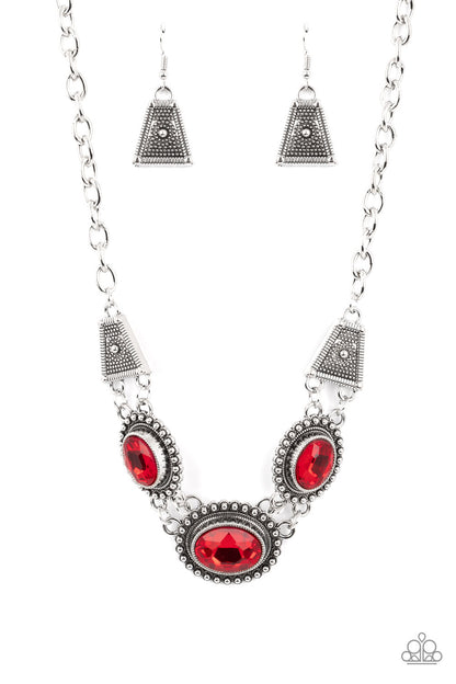 Textured TRAPEZOID Red Necklace - Paparazzi Accessories  Classic oval-shaped rhinestones in a vibrant red hue sit prominently atop silver frames bordered in studded texture. Trapezoidal shaped frames filled with dizzying silver texture lay on each side of the colorful gems, as they fall along the collar in a breathtaking finish. Features an adjustable clasp closure.  Sold as one individual necklace. Includes one pair of matching earrings.
