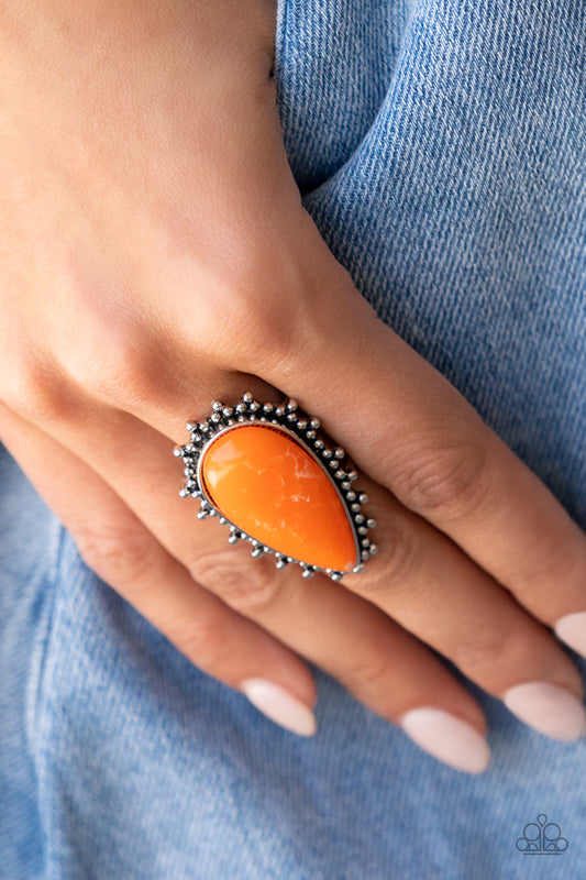 Down-to-Earth Essence Orange Ring - Paparazzi Accessories   Chiseled into a tranquil teardrop, a refreshing orange stone is pressed into the center of a studded silver frame for an earthy ensemble. Features a stretchy band for a flexible fit.  Sold as one individual ring.