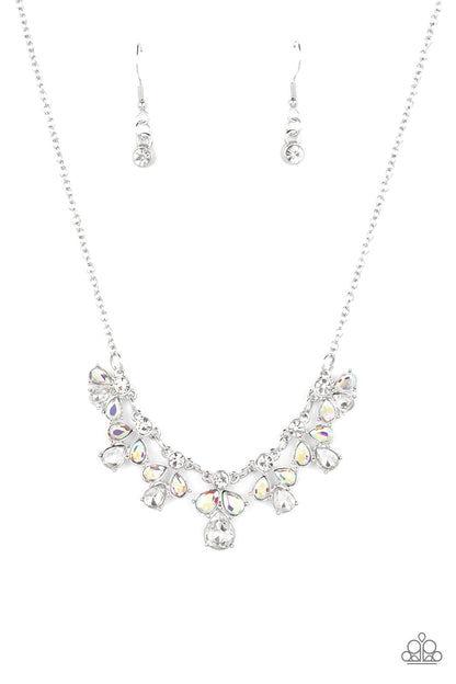 See in a New STARLIGHT White Necklace - Paparazzi Accessories  Dainty white reflective gems, followed by a trio of iridescent and reflective teardrop gems vertically blaze down the collar, creating a starry shimmer. Due to its prismatic palette, color may vary. Features an adjustable clasp closure.  Sold as one individual necklace. Includes one pair of matching earrings.