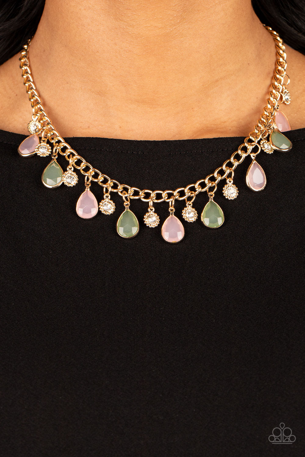 Frosted and Framed Multi Necklace- Paparazzi Accessories ﻿  A thick gold chain is decorated in faceted Loden Frost and baby pink teardrops wrapped in gold frames. The opacity of the beads adds a dreamy feel to the design, while tiny gold accents dotted with white rhinestone centers add a hint of shimmer. Features an adjustable clasp closure.  Sold as one individual necklace. Includes one pair of matching earrings.