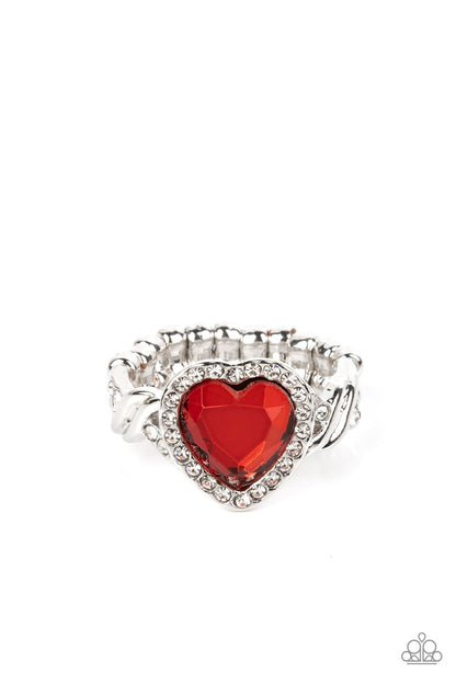 Committed to Cupid Red Ring - Paparazzi Accessories  A faceted red heart gem is pressed into a silver heart frame studded with dainty white crystals for a romantic centerpiece atop the finger. Textured twists dotted with similar dainty crystals climb up the sides of the ring for additional sparkle. Features a dainty stretchy band for a flexible fit.  Sold as one individual ring.