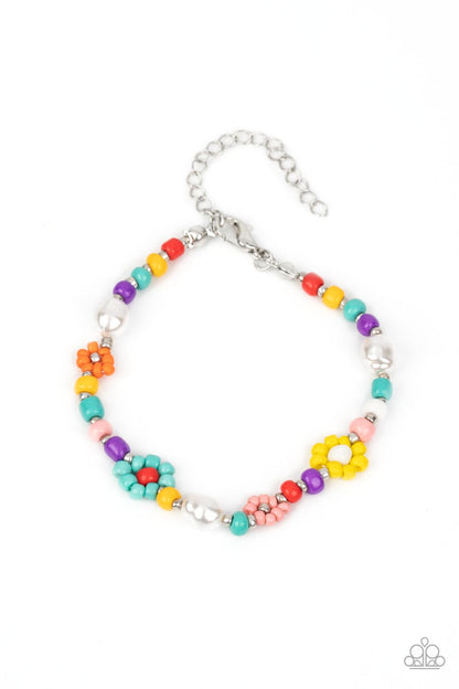 Modeled after gerber daisies, multicolored seed beed petals in shades of Tiffany, orange, pink, and yellow bloom around white, red, and silver beaded centers resulting in a dazzling collection of florals around the wrist. Varying sizes of beads in the same shades, along with a couple of small baroque pearls, separate the floral designs in a far-out finish. Features an adjustable clasp closure.  Sold as one individual bracelet.