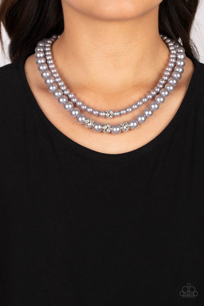 Brilliant Ballerina Silver Pearl Necklace - Paparazzi Accessories   Two strands of classic silver pearls in varying sizes coalesce around the collar in a refined fashion. Silver beads, encrusted in white rhinestones, introduce shimmery detail to each pearly layer, adding a playful spark of shimmer to the timeless design. Features an adjustable clasp closure.  Sold as one individual necklace. Includes one pair of matching earrings.