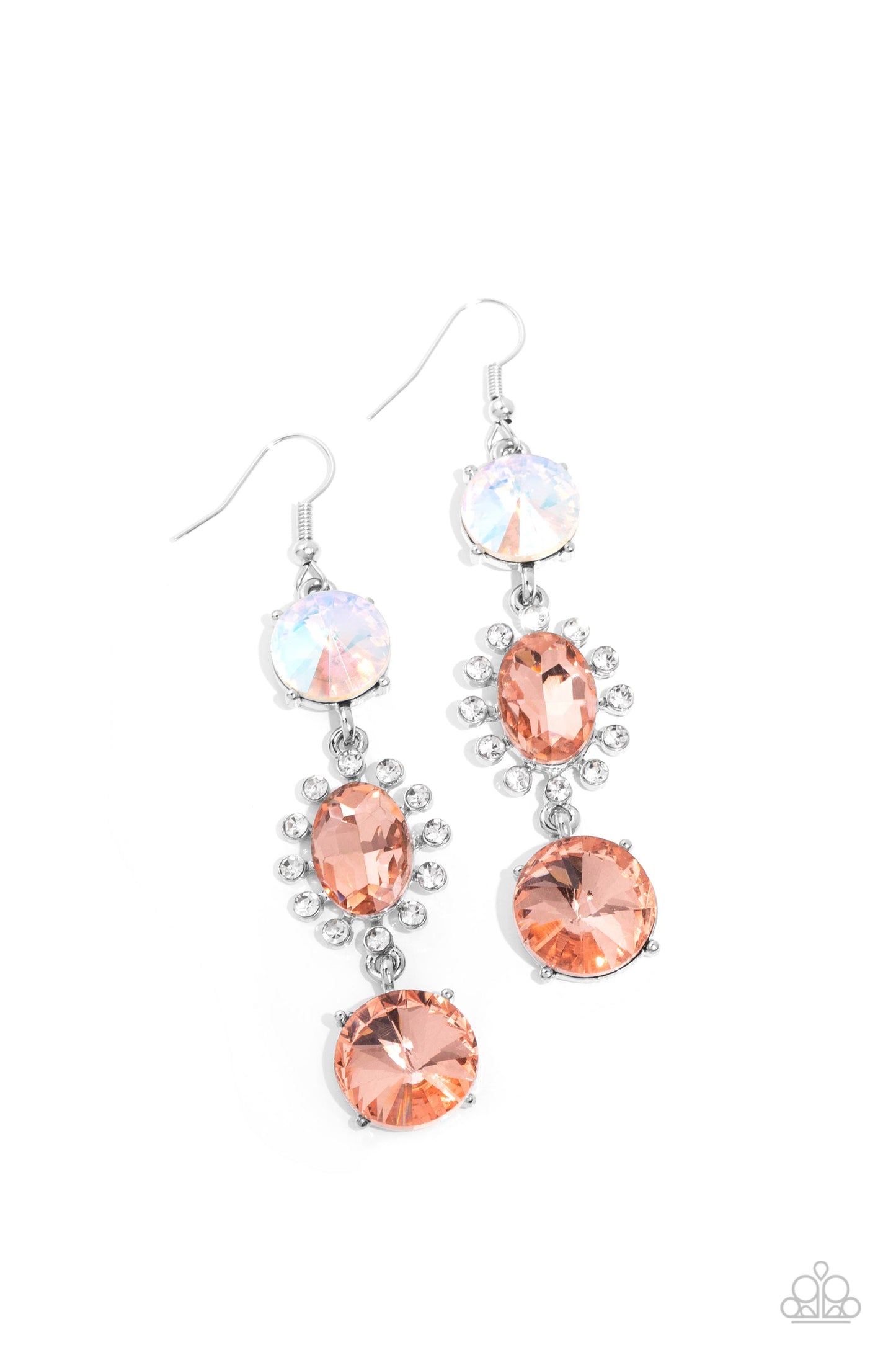 A trio of colorfully iridescent and brilliantly sparkling peach gems are linked together as they fall glamorously from the ear. A round-cut gem with an exaggerated faceted surface anchors the cascade, followed by an oval-cut peach rhinestone bordered in classic white rhinestones. Another round-cut gem — this one in a peach hue — finishes off the design in a sparkling finish. Earring attaches to a standard fishhook fitting. Due to its prismatic palette, color may vary.  Sold as one pair of earrings.
