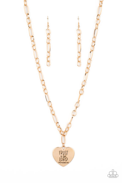 Perennial Proverbs Gold Necklace - Paparazzi Accessories  Dangling from a gold figaro chain, a charming heart pendant swings. Stamped upon the shiny surface, the phrase "Trust in the Lord" with the bible reference listed below it "Proverbs 3:5" are listed in different fonts for an optimistic and hopeful finish. Features an adjustable clasp closure.  Sold as one individual necklace. Includes one pair of matching earrings.